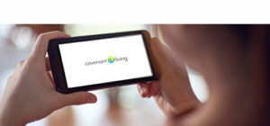 A patient looking at their phone with the Covenant Living Logo